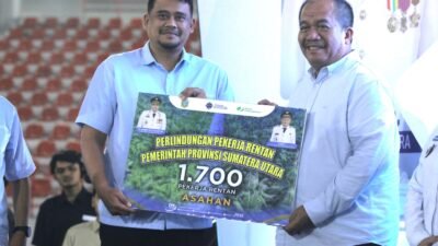 Peringatan May Day 2026, Bupati Asahan Terima 1.700 Kartu BPJS Ketenagakerjaan Untuk Pekerja Rentan